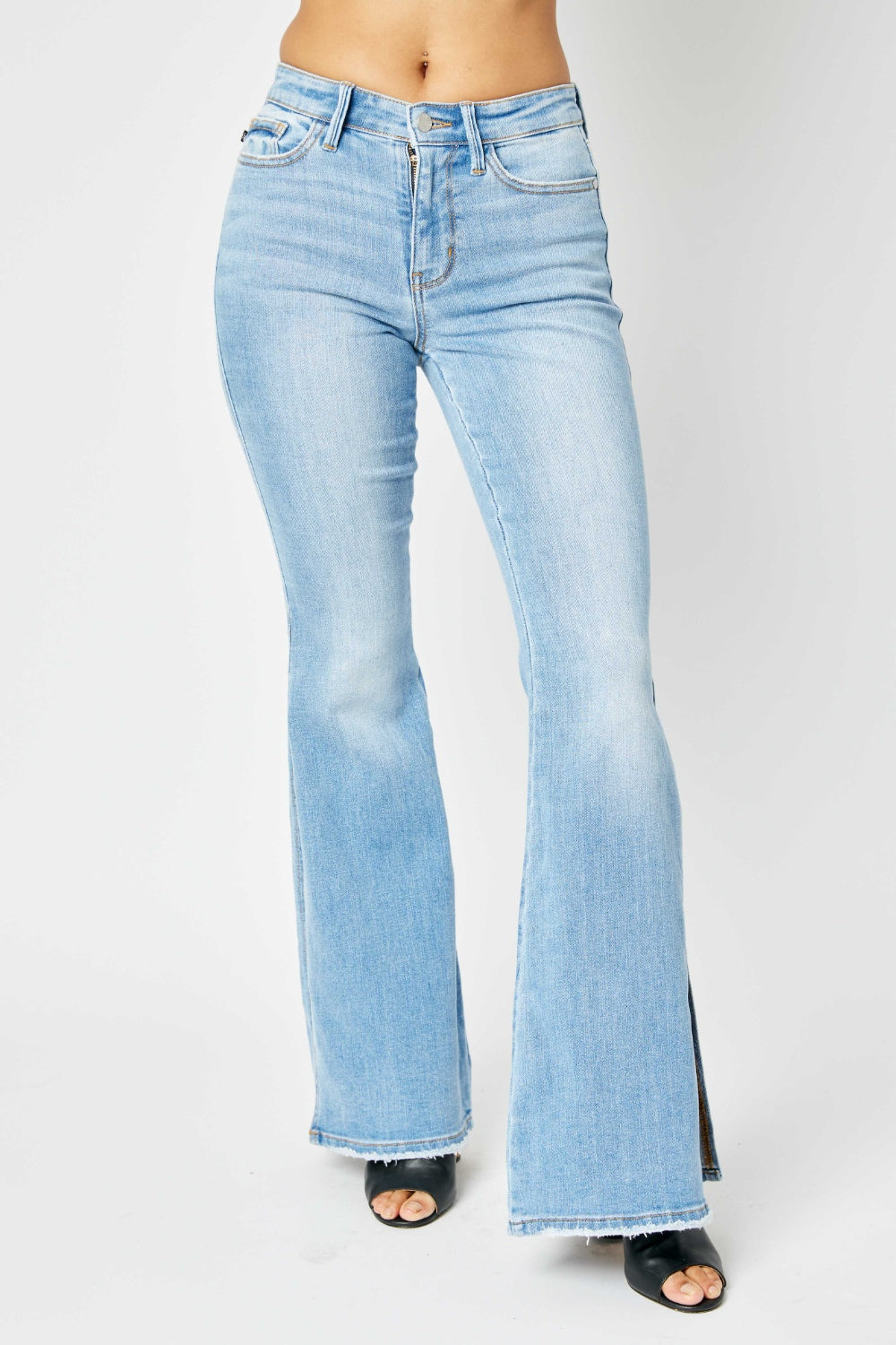 Judy Blue Full Size Mid Rise Raw Hem Slit Flare Jeans Judy Blue Full Size Mid Rise Raw Hem Slit Flare Jeans - TopFashionHQ