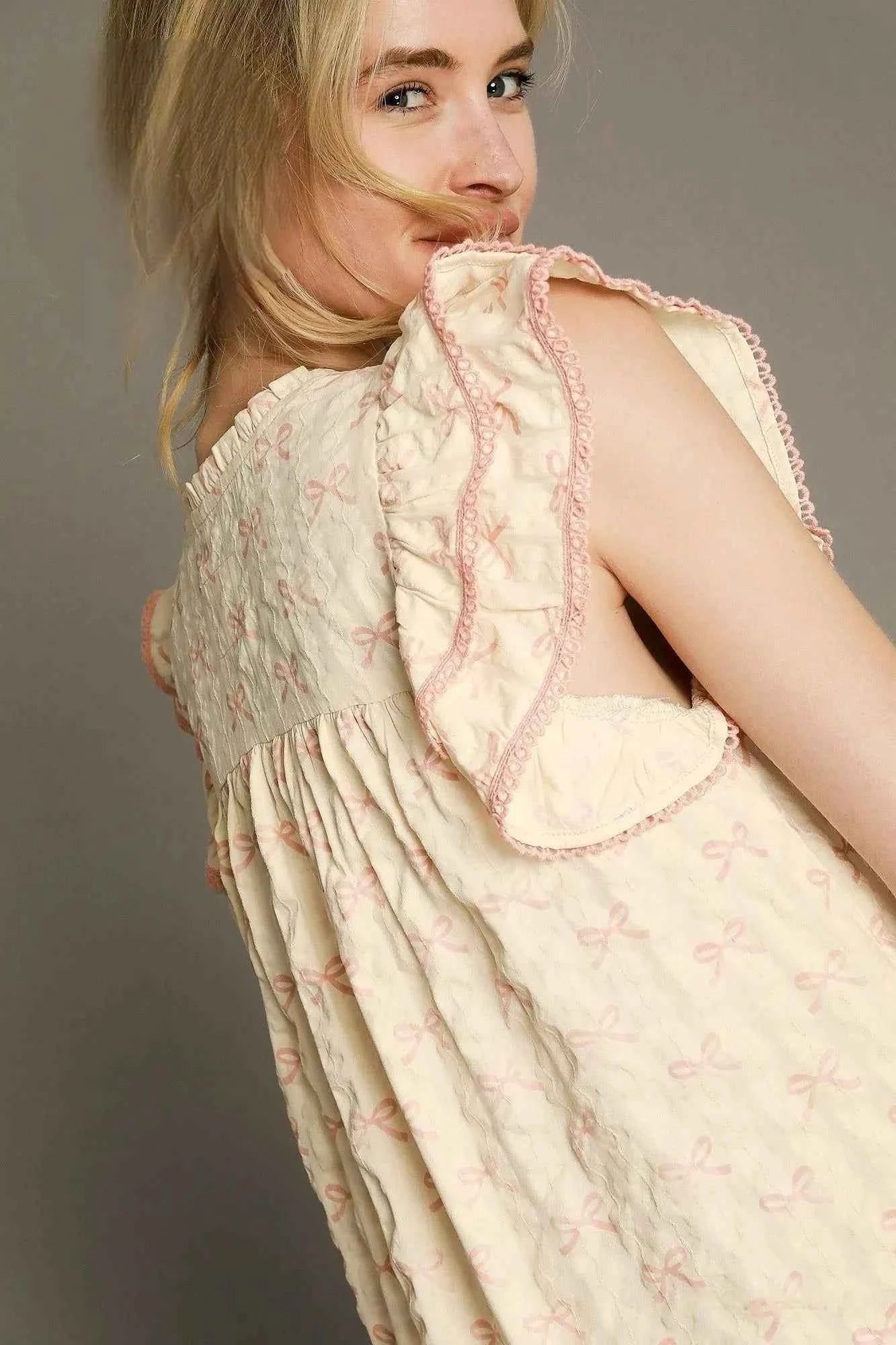Umgee Bow Print Ruffled Cap Sleeve Mini Dress Umgee Bow Print Ruffled Cap Sleeve Mini Dress
