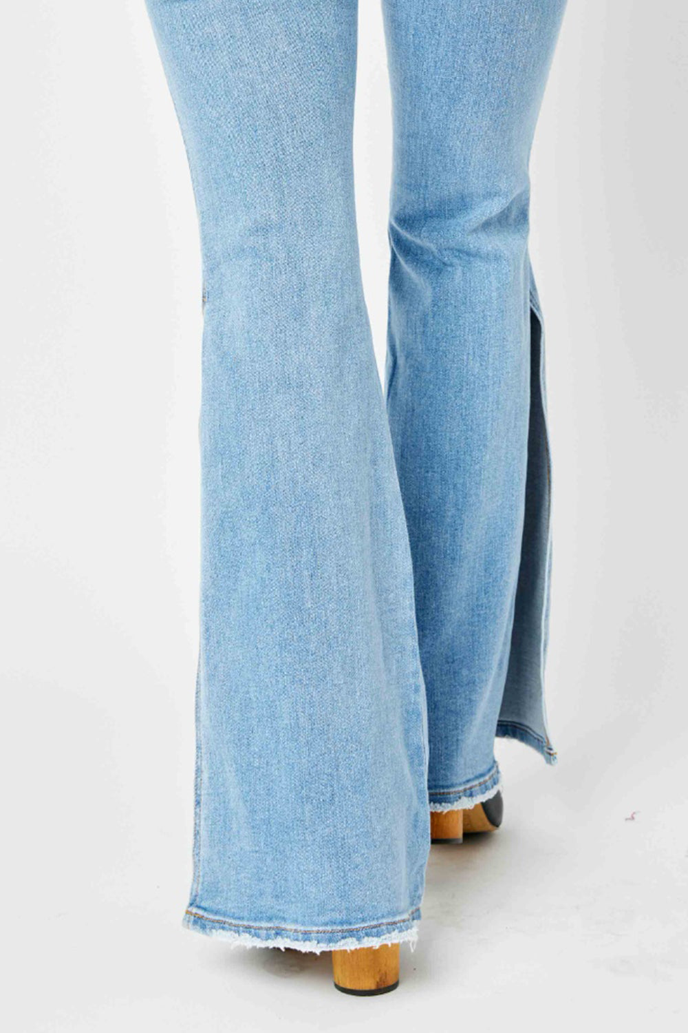 Judy Blue Full Size Mid Rise Raw Hem Slit Flare Jeans Judy Blue Full Size Mid Rise Raw Hem Slit Flare Jeans - TopFashionHQ