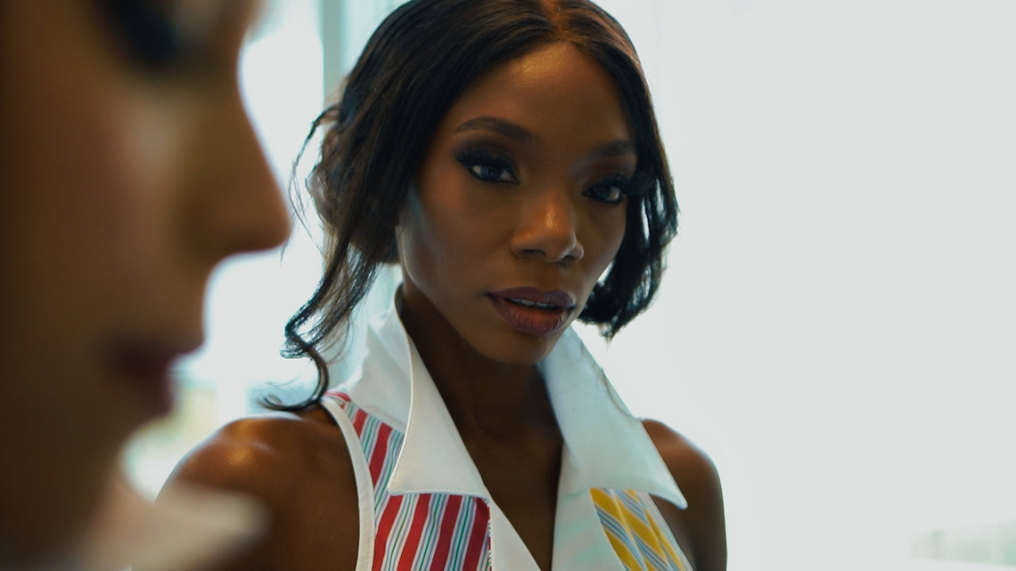 a woman with a tie around her neck