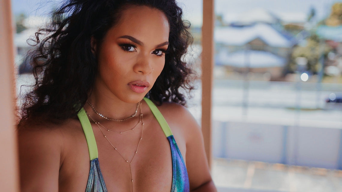 a close up of a person wearing a bikini top