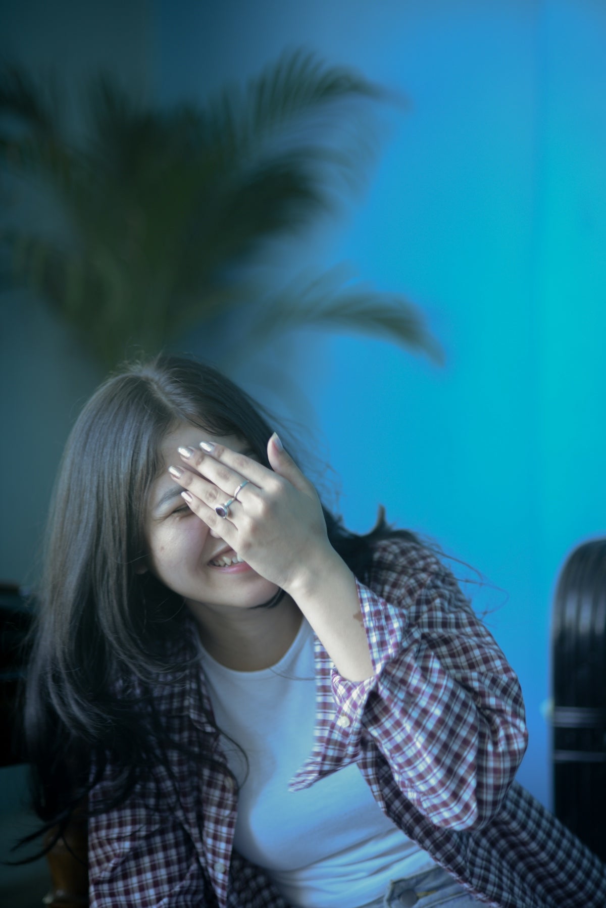 a woman with her hand on her face