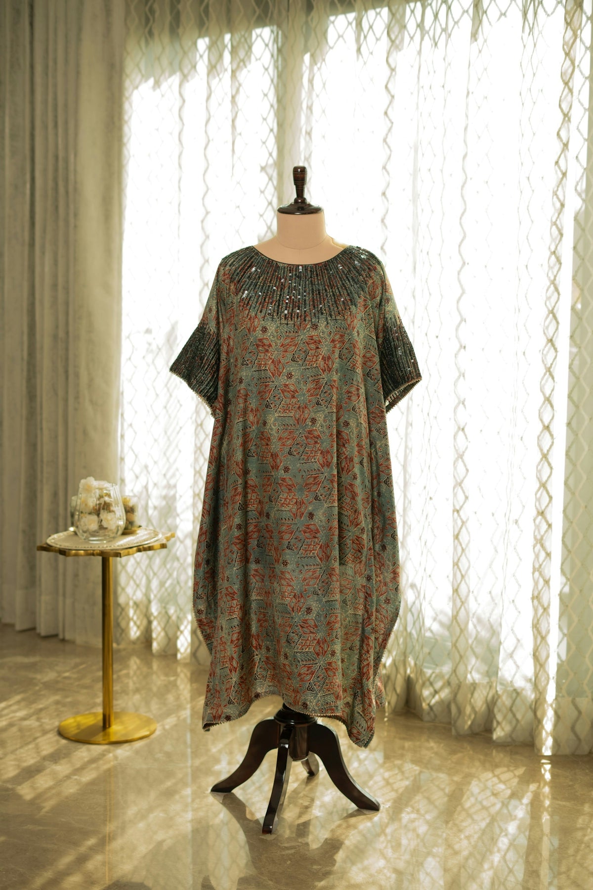 A dress on a mannequin in a room