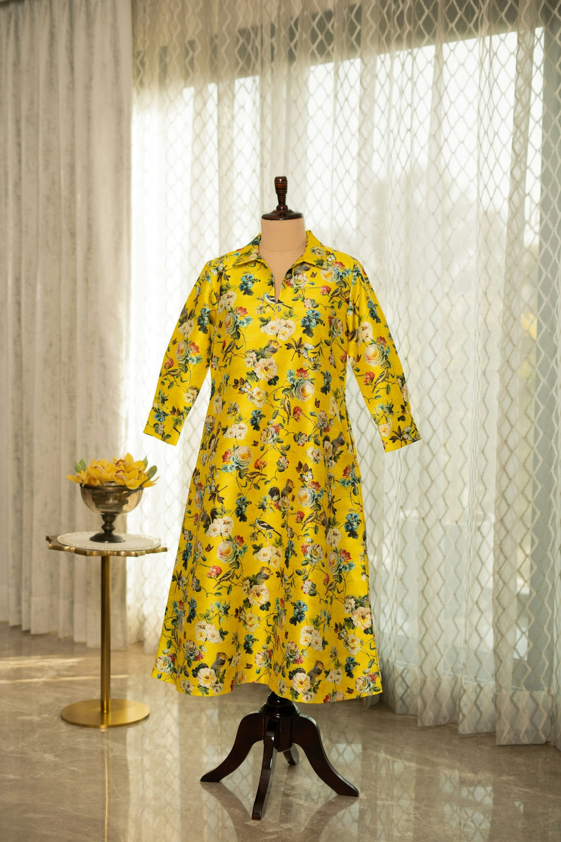 A dress on a mannequin in a room