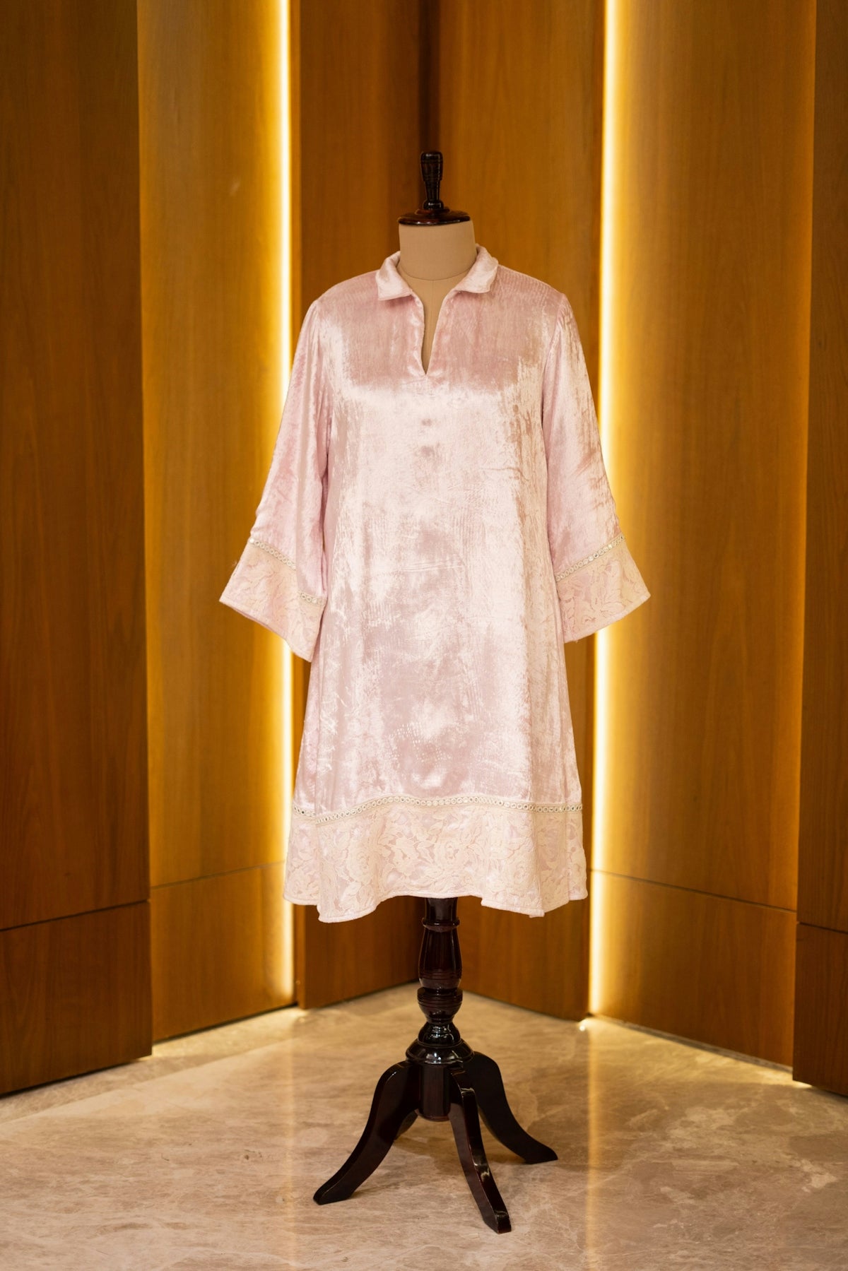 A dress on a mannequin in a room