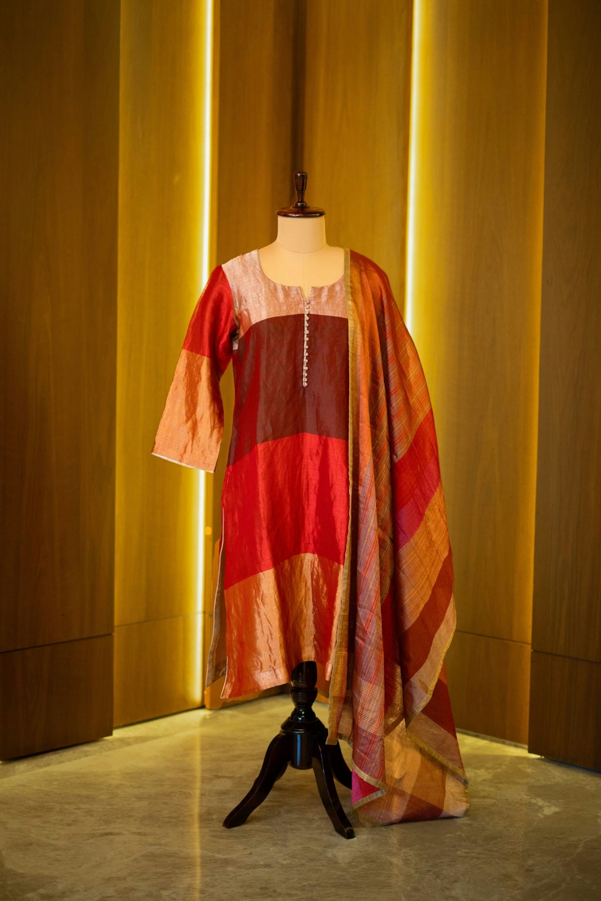 A dress on a mannequin in a room