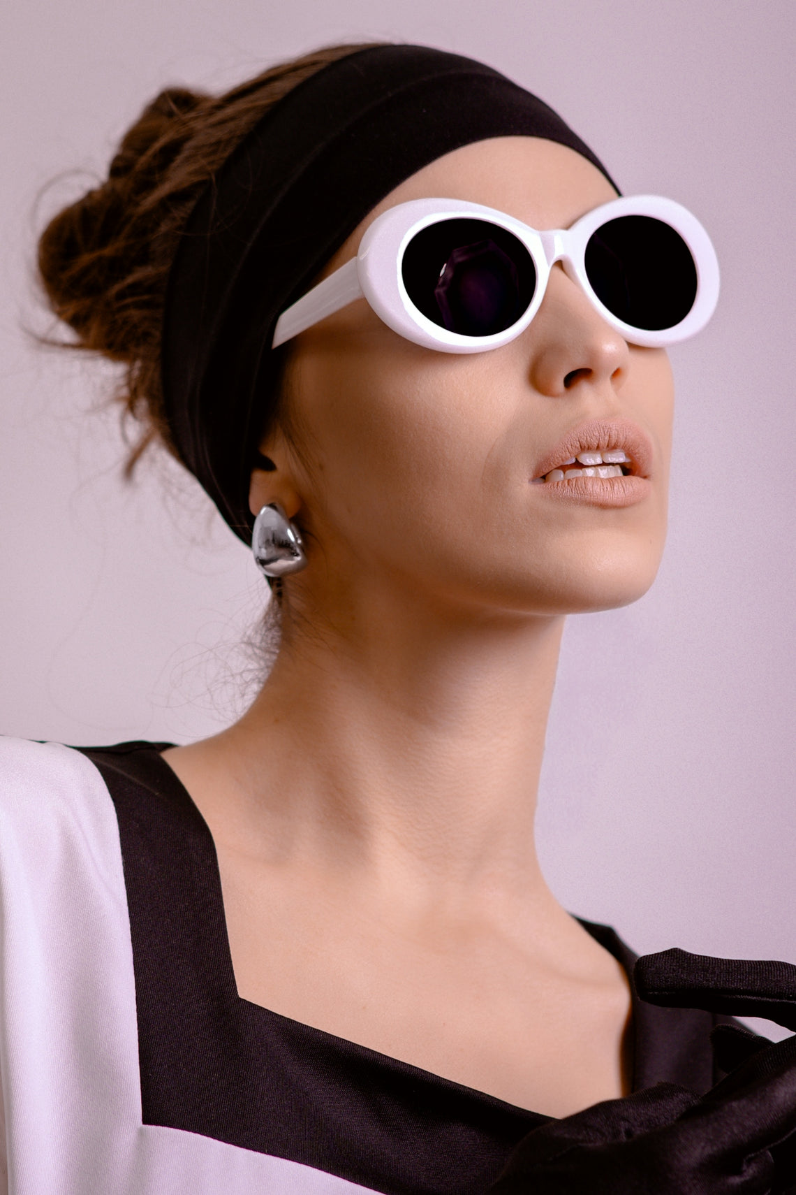 Woman with sunglasses and black headband